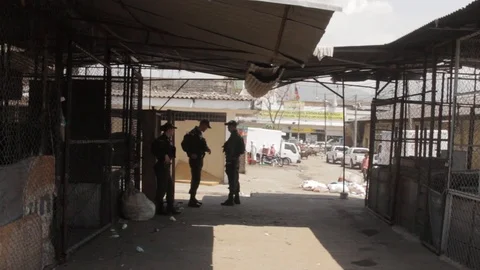 Police task force having a conversation in dangerous area of Santa Elena Video stock 88467336