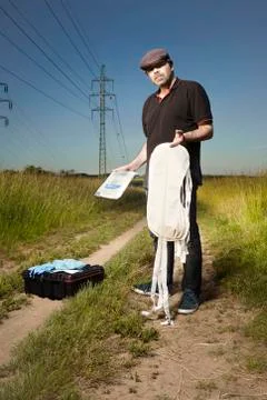 Police technician in fields dressing protective equipment Stock Photos
