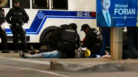 Police with two activist Stock Footage 120094585