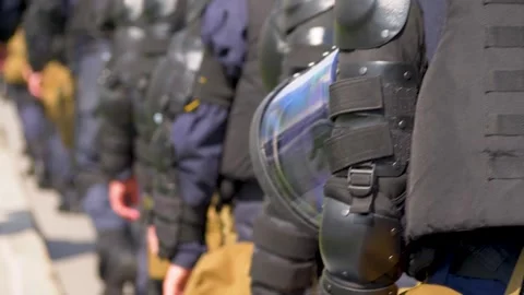 Police units align to ensure security at public rally Stock Footage 339770484