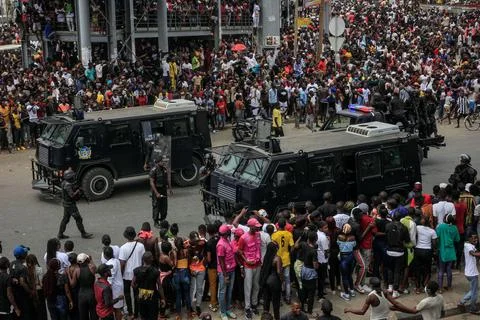 Police use tear gas to disperse crowds before funeral of kuduro star in Angola,  Stock Photos