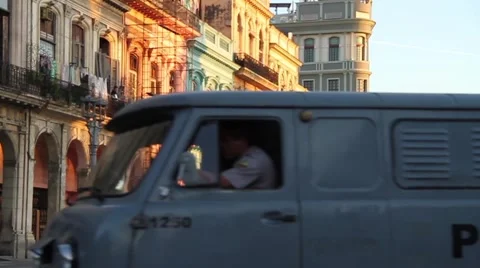 Police Van, crosses frame in Old Havana street, Cuba Video stock 45521481