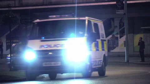 Police Van Driving Towards Camera at Night HD Stock Footage 24970064
