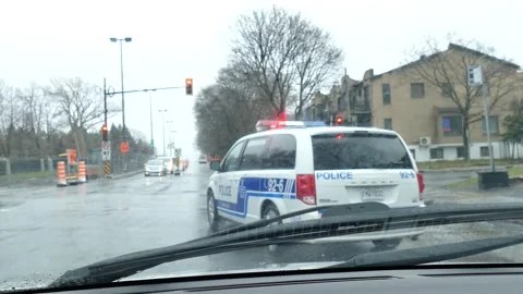 Police van passing by car driver Stock Footage 139664313