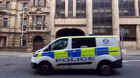A police van passing by an old building Video stock 200262209