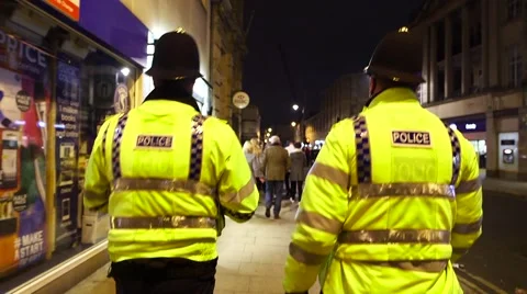 Police Walking UK Hard Hats Stock Footage