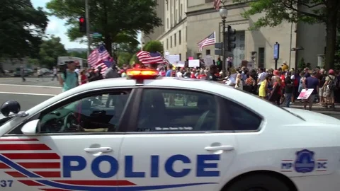 Police watching closely during protests in Washington, DC Stock Footage