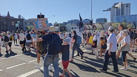 POLICE WATCHING AS PROTESTERS MARCH TO SUPPORT THE VOICE FIRST NATIONS AUSTRALIA Stock Footage 250446486