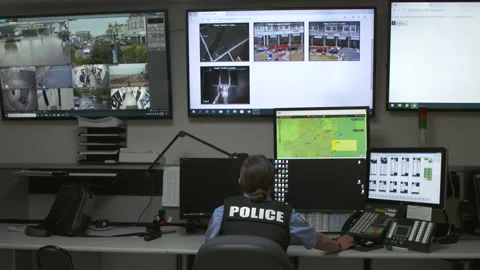 Police Woman at Computer Dispatch Station Wide 4K Stock Footage