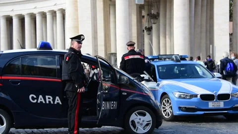 Policeman and two Carabinieri control people around Vatican City Stock Footage 163224221