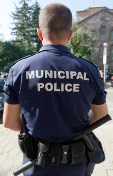 Policeman back view Stock Photos