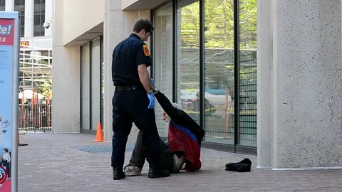Policeman carry hands of unknown men on the street, San Francisco, USA Video stock 75571171