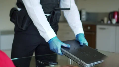 Policeman checking laptop at crime scene Stock Footage 110746554