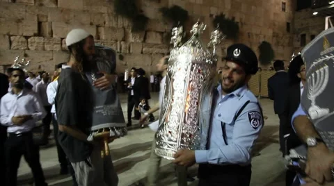 Policeman dances with Bible Torah scroll inaugurated in Western Wall Stock Footage 53346639