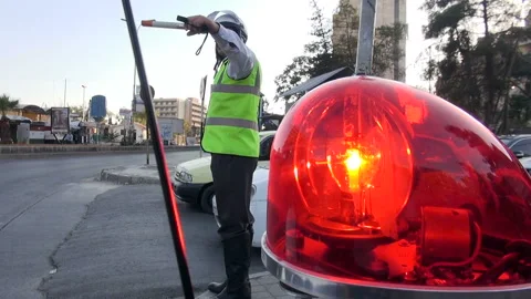 Policeman directing traffic at an intersection in Aleppo, Syria Stock Footage 155313800