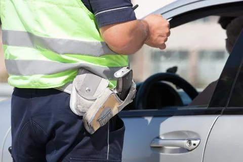 Policeman doing a traffic control Stock Photos