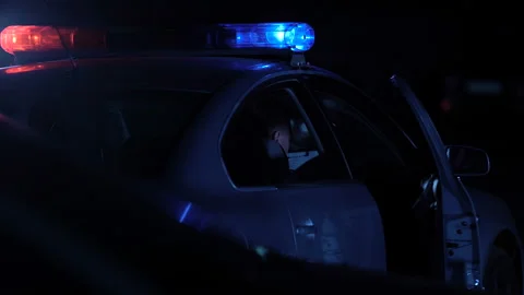 Policeman going to make notes about victim on place of murder, crime scene Stock Footage 100549560