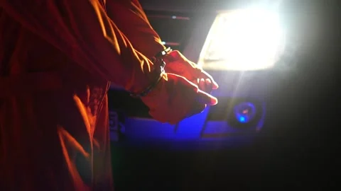 Policeman Handcuffing Convict at a Law and Justice Court Trial 動画素材 219940262