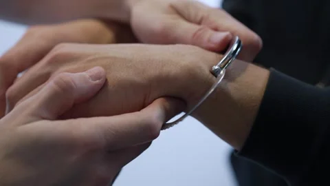 Policeman Handcuffs Suspect During Arrest Procedure Stock Footage 312475507