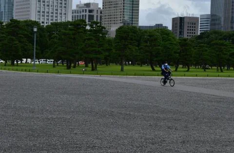 The policeman with a mask circulating alone in the empty Imperial Palace Stock Photos