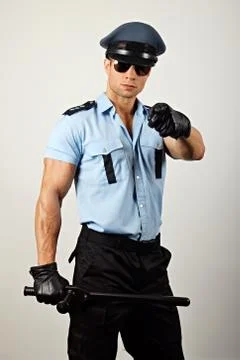 Policeman with nightstick Stock Photos