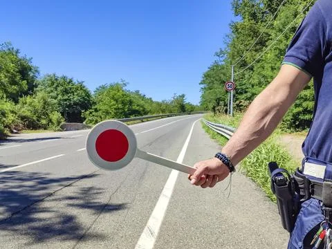 Policeman with a paddle close-up 스톡 사진