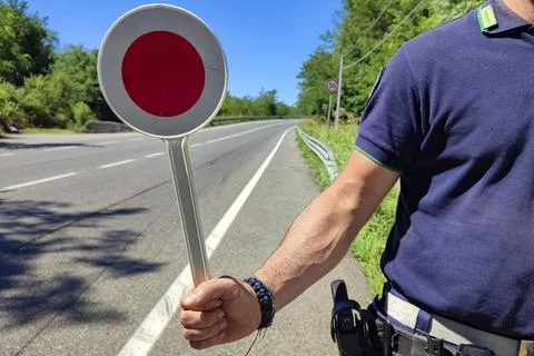 Policeman with a paddle close-up 스톡 사진