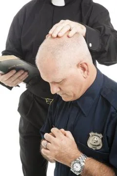 Policeman in Prayer Stock Photos