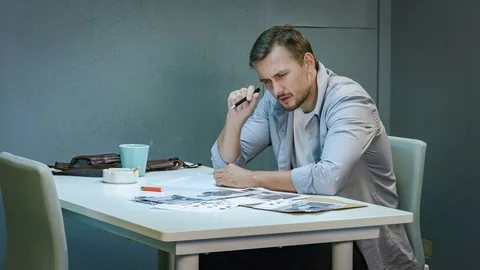 Policeman is reviewing files and documents Stock Footage 69743112