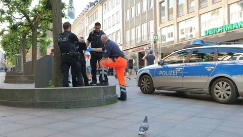 Policemens helping to a sick man Stock Footage 76491246