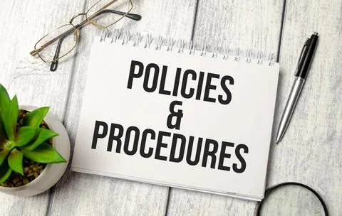 Policies and procedure text on notepad with glasses, pen and calculator Stock Photos