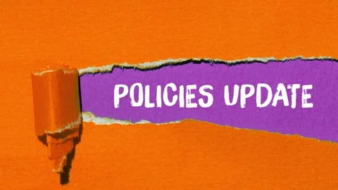 Policies update message writing on ripped torn paper background Stock Footage 344538620