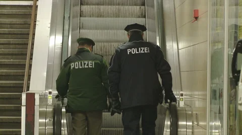 Policmen going up on escalator Video stock 1089927