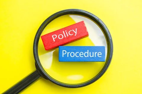 Policy Procedure text under magnifying glass representing rules, process, a.. Фото