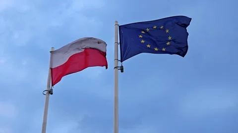 Polish and EU flags flying on a cloudy day. Stock Footage 320831479