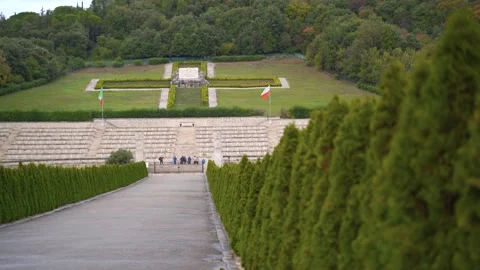 Polish cemetery at Monte Cassino from straight asphalt walkway lined with Stock Footage 133242053