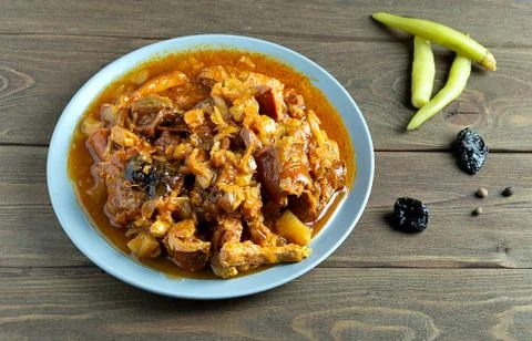 Polish dish bigos made from cabbage, meat and sausages. In a gray plate, on a 写真素材