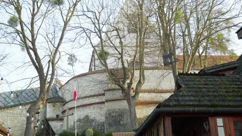 The Polish flag against the background of the castle in the old town. The flag Stock Footage 304774855