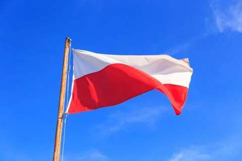 Polish flag on the blue sky Foto stock