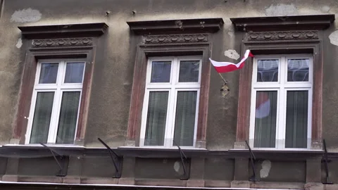 Polish flag on facade of old building with windows. Stock Footage 335498381