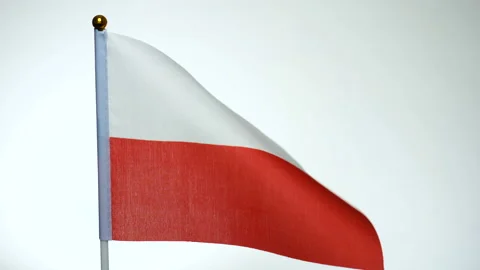 Polish flag on flagpole flying and waving in the wind. Stock Footage 124062386