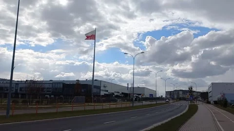 The Polish flag flutters against the backdrop of an urban environment Stock-Footage 178504906