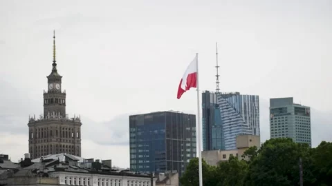 Polish flag flying in the wind with Warsaw downtown in the background Stock Footage 196209736