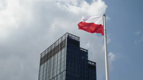Polish flag with office building in the background Stock Footage 187661340