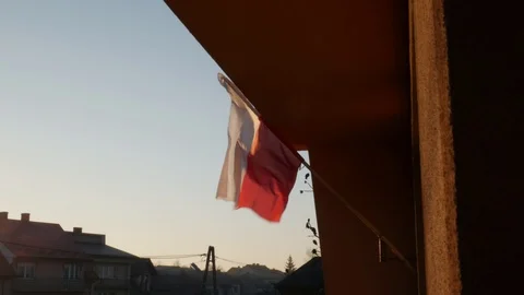 Polish Flag Waving in The Wind at Sunset in the Countryside Stock Footage