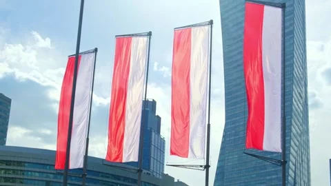 Polish flags fluttering in the background of the city Stock Footage 252910881
