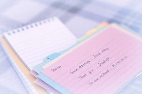 Polish; Learning New Language Writing Greetings on the Notebook Stock Photos
