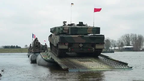 Polish Leopard tank embarking on rig amphibious vehicle for river crossing Video stock 267074254