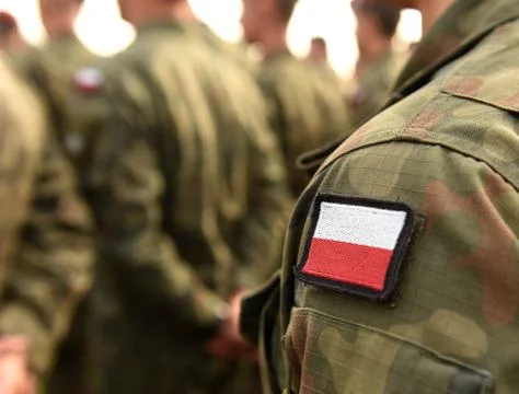 Polish patch flag on soldiers arm. Poland military uniform. Poland troops Stock Photos