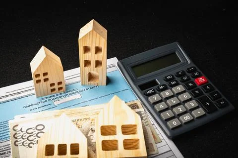 Polish PIT tax forms and wooden house models showcasing financial planning .. Stock Photos